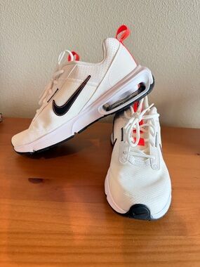 Nike Kids White Sneakers with Black Swoosh and Coral Accents